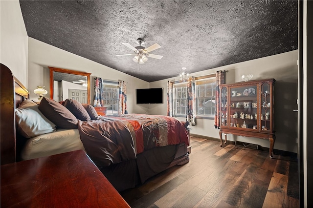 bedroom with a textured ceiling, ceiling fan, lofted ceiling, and wood-type flooring