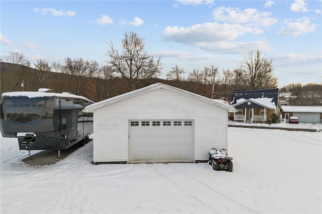 view of snow covered garage