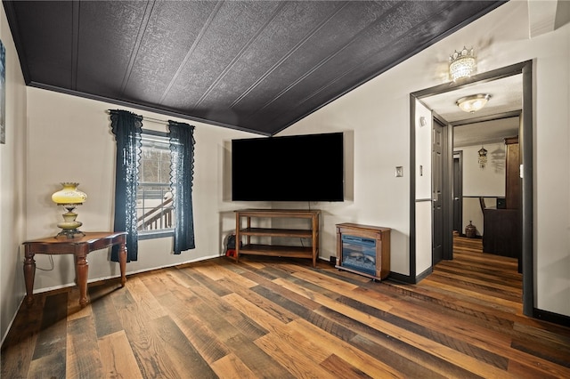 living room with wood-type flooring and vaulted ceiling