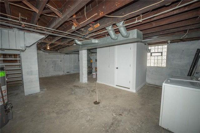 basement featuring washer and dryer and gas water heater