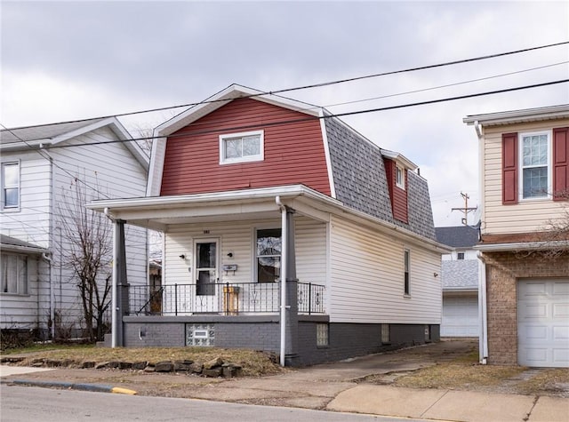 view of front of home with a garage and covered porch