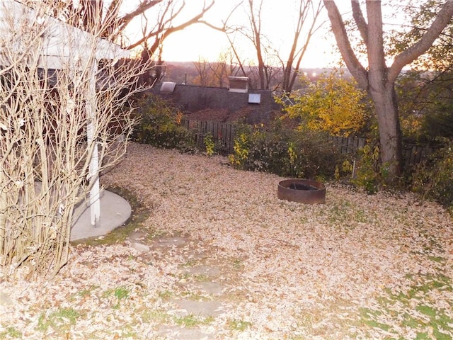 view of yard with an outdoor fire pit