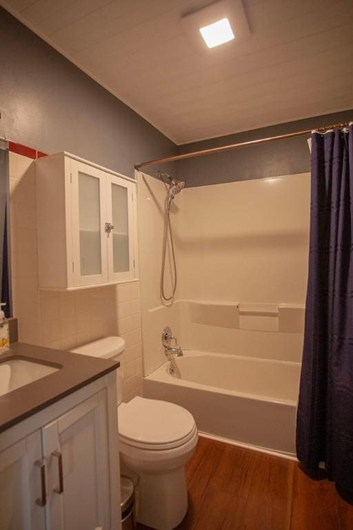 full bathroom with toilet, shower / tub combo, wood-type flooring, and vanity