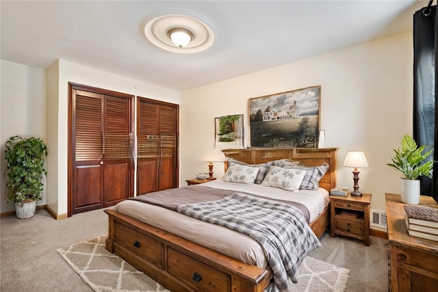 bedroom featuring carpet flooring, visible vents, and baseboards