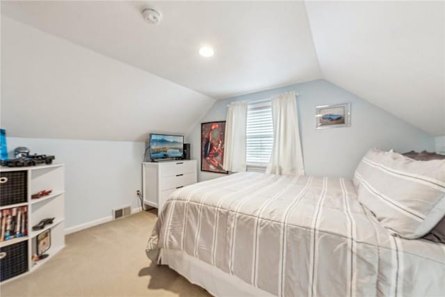 carpeted bedroom featuring vaulted ceiling