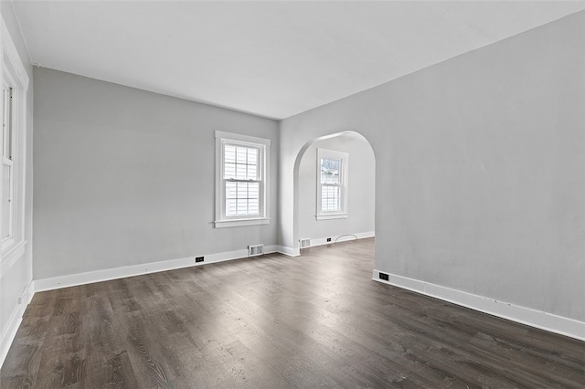 unfurnished room with dark hardwood / wood-style floors