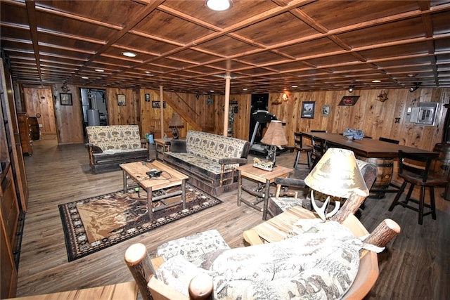 interior space with wooden ceiling, hardwood / wood-style floors, wooden walls, and coffered ceiling