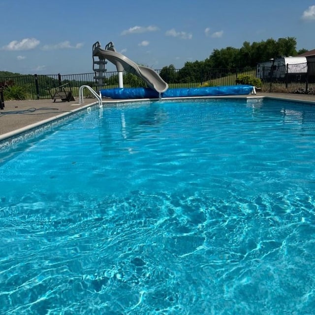 view of pool featuring a water slide