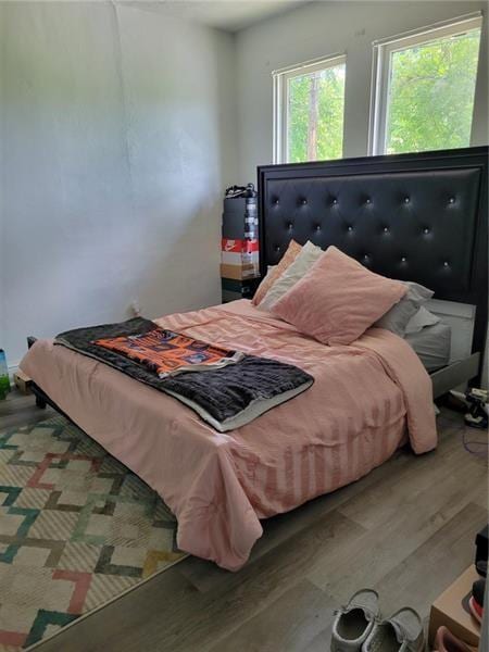 bedroom featuring hardwood / wood-style flooring