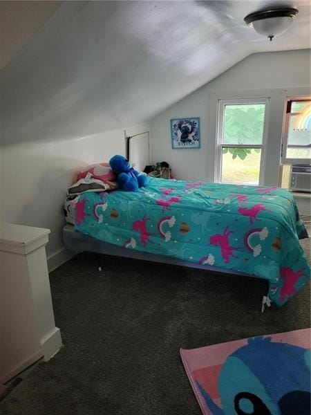 bedroom with lofted ceiling and dark carpet