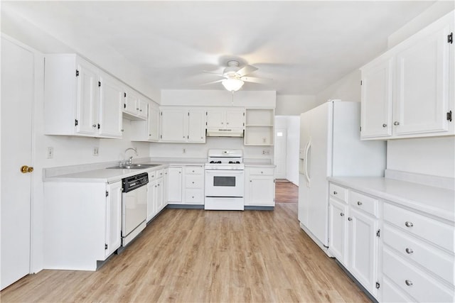 kitchen featuring white appliances, white cabinets, sink, ceiling fan, and light hardwood / wood-style flooring