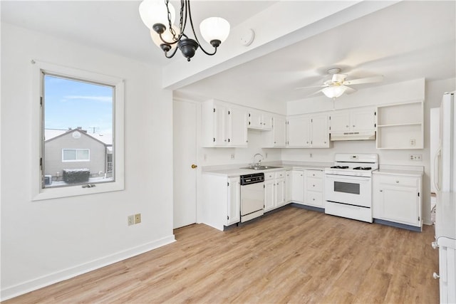 kitchen with sink, white cabinetry, pendant lighting, and white appliances