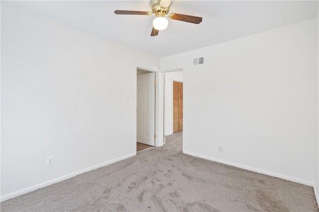 carpeted empty room with ceiling fan