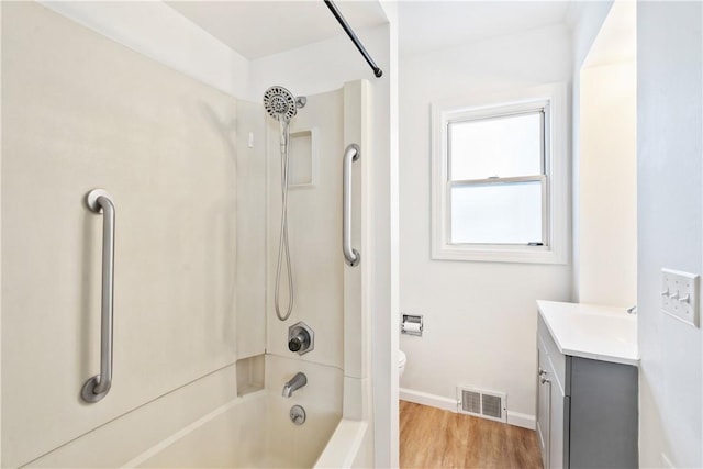 full bathroom with toilet, shower / bath combination, vanity, and hardwood / wood-style floors