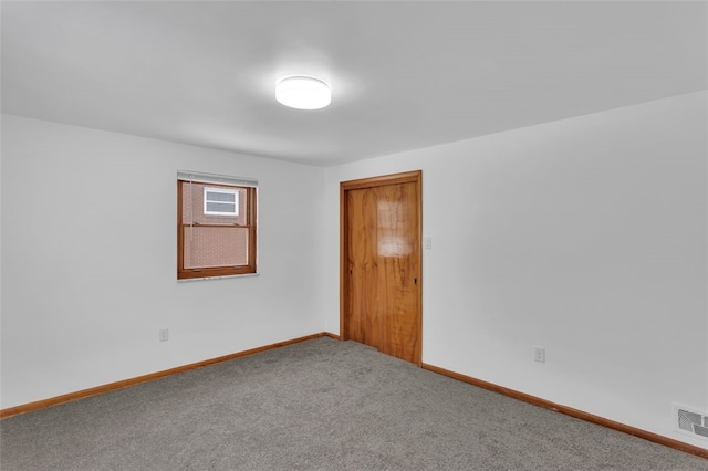 unfurnished room featuring carpet flooring