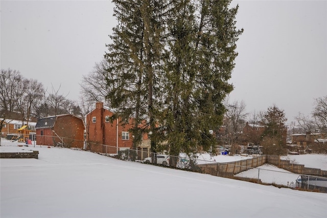 view of yard covered in snow