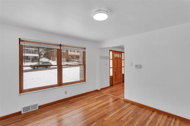 spare room featuring light hardwood / wood-style flooring