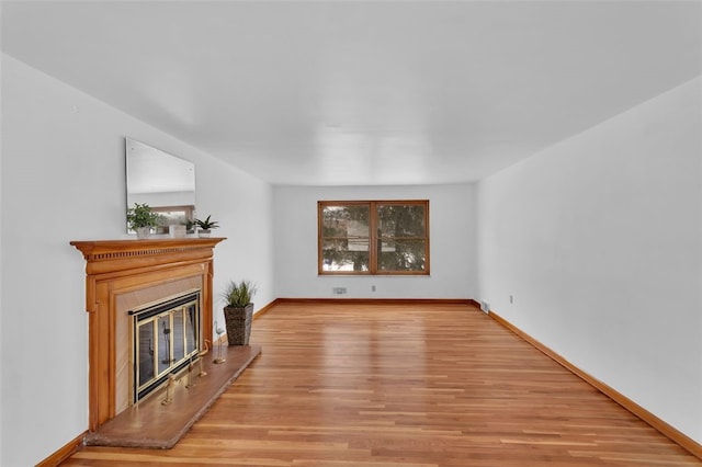 unfurnished living room featuring light wood-type flooring