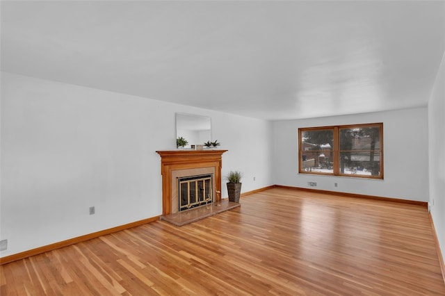 unfurnished living room with light hardwood / wood-style floors