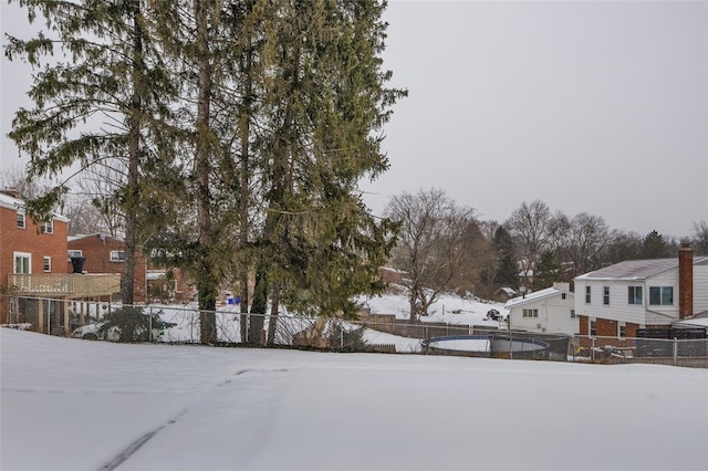 view of yard layered in snow