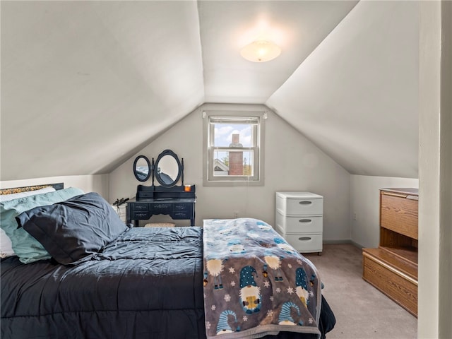 carpeted bedroom featuring lofted ceiling