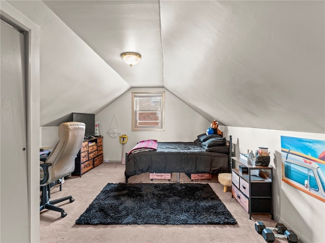 bedroom with light colored carpet and vaulted ceiling