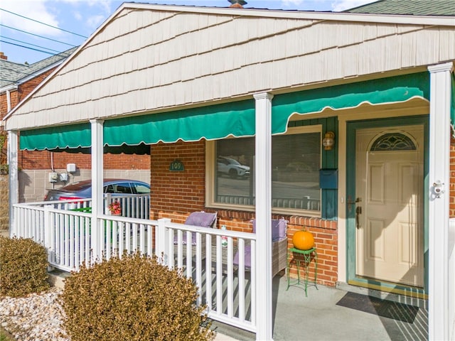 view of side of property featuring a porch