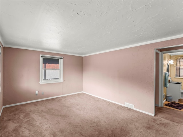 carpeted empty room with ornamental molding