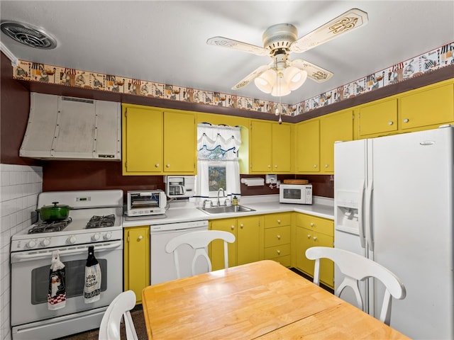 kitchen with ceiling fan, sink, backsplash, and white appliances