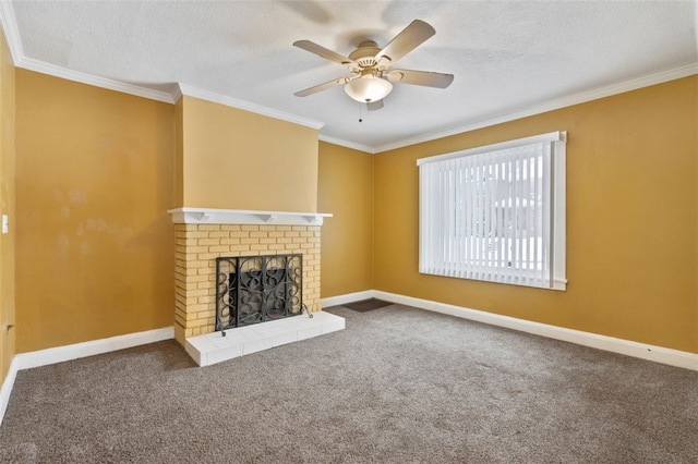 unfurnished living room with ceiling fan, a fireplace, crown molding, carpet flooring, and a textured ceiling