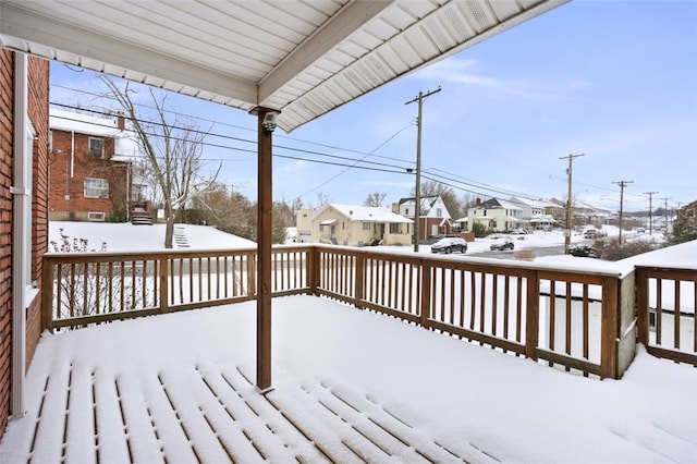 view of snow covered deck