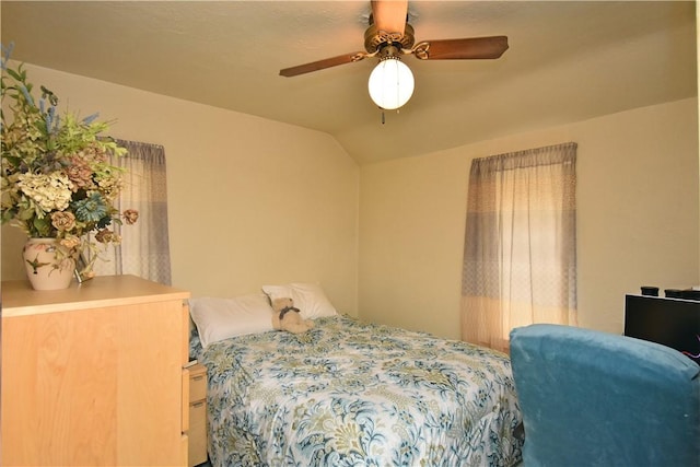 bedroom featuring vaulted ceiling and ceiling fan