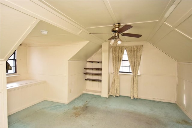 bonus room featuring ceiling fan, light colored carpet, and vaulted ceiling