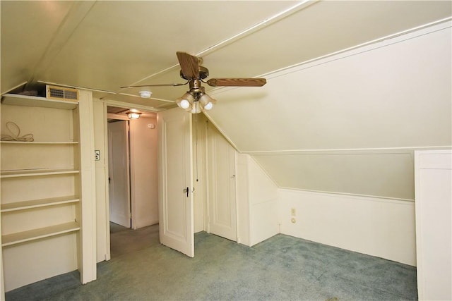 additional living space featuring carpet floors, ceiling fan, and vaulted ceiling