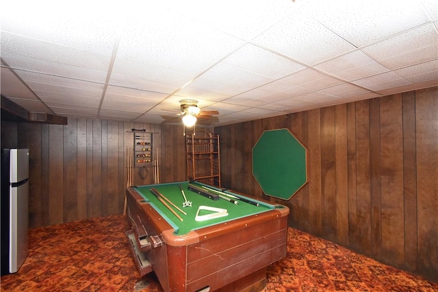 game room featuring ceiling fan, billiards, a paneled ceiling, and wooden walls