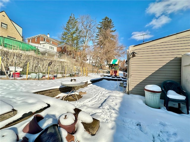 view of yard layered in snow