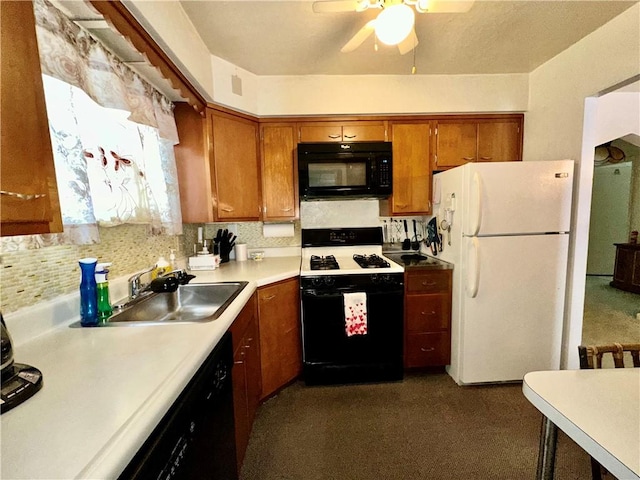 kitchen featuring black appliances, ceiling fan, and sink