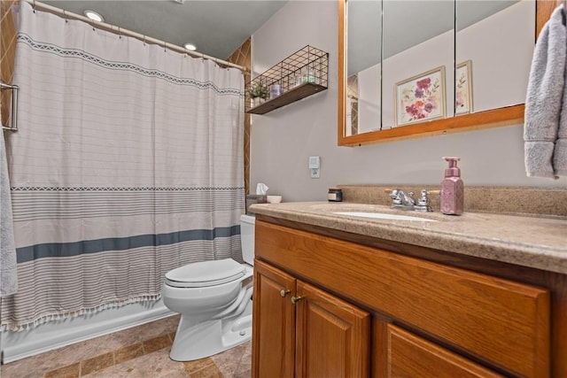 bathroom with walk in shower, vanity, and toilet