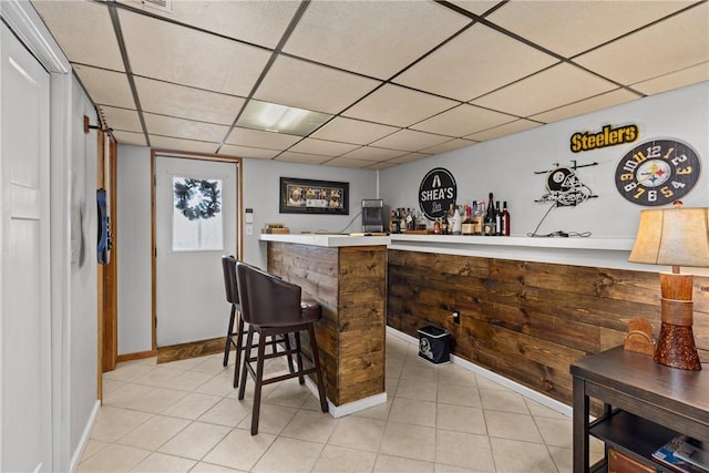 bar featuring a drop ceiling