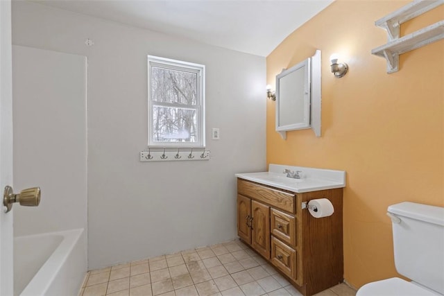 bathroom with a bath, toilet, and vanity