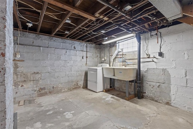 basement featuring washer / clothes dryer and sink