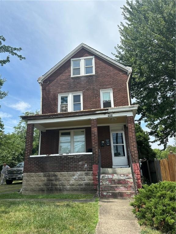 view of front of home featuring covered porch