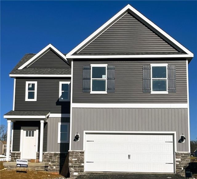 view of front of property with a garage