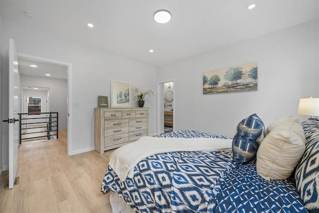 bedroom featuring light wood-type flooring