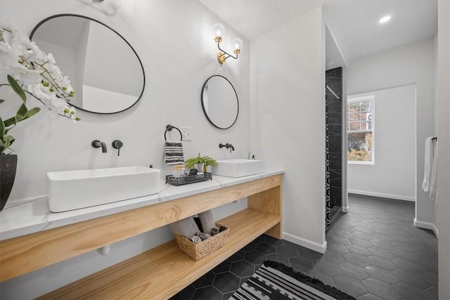 bathroom with tile patterned floors and vanity