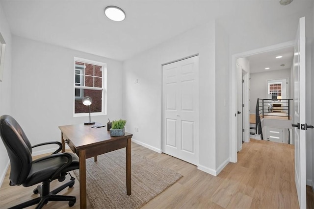 office featuring a wealth of natural light and light hardwood / wood-style floors