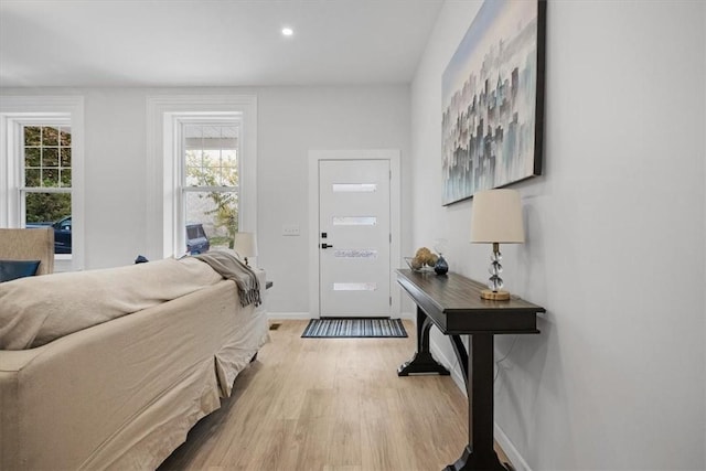 foyer entrance with light wood-type flooring