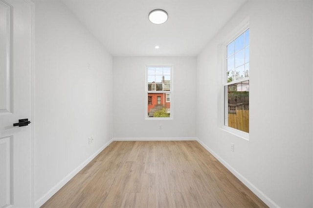 unfurnished room featuring light hardwood / wood-style flooring