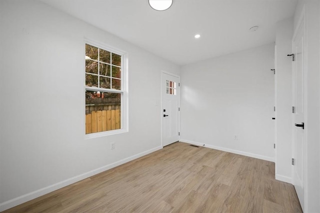 unfurnished room featuring light hardwood / wood-style flooring