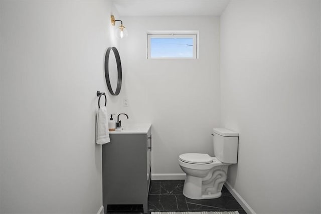 bathroom with toilet and vanity